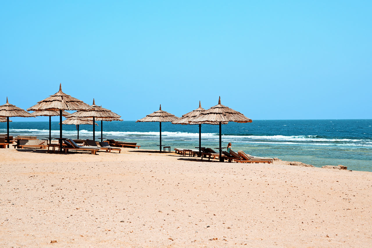 Stranden vid Siva Oasis & Sands