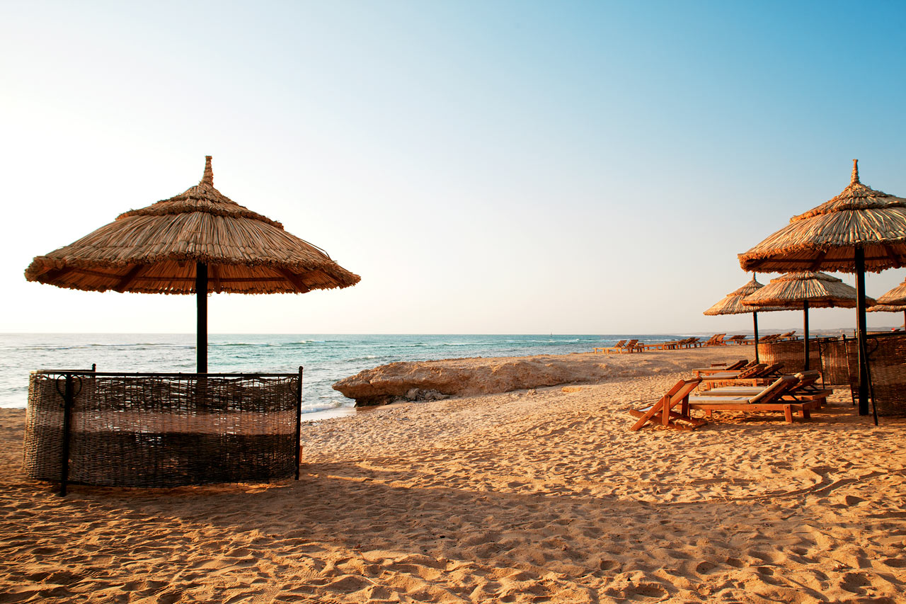 Stranden vid Siva Oasis & Sands